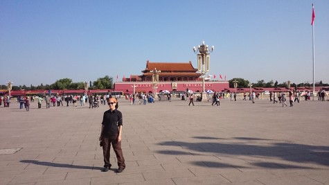 Standing with swag in front of Tiananmen